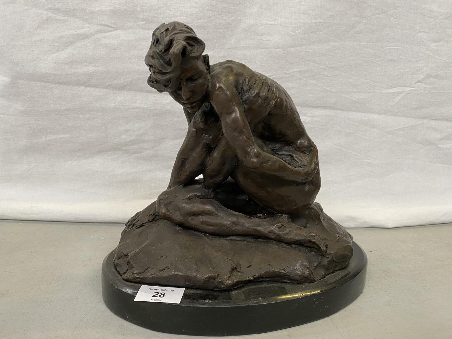 A BRONZE DISCREETLY NUDE FIGURE ON A MARBLE BASE