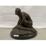 A BRONZE DISCREETLY NUDE FIGURE ON A MARBLE BASE