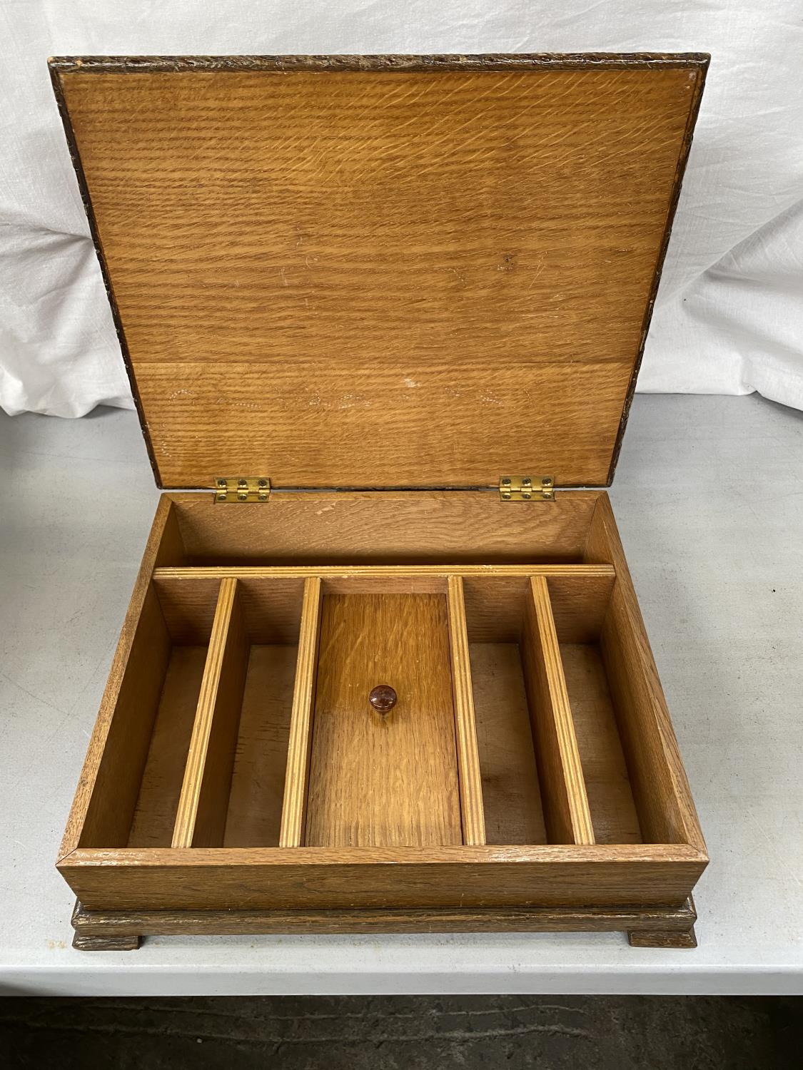 A WOODEN STORAGE BOX WITH INNER COMPARTMENTS