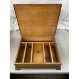 A WOODEN STORAGE BOX WITH INNER COMPARTMENTS