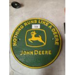 A CAST IRON JOHN DEERE SIGN 22.5CM ACROSS