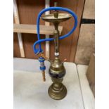 A BRASS SHISHA PIPE WITH A BLUE BRAIDED PIPE