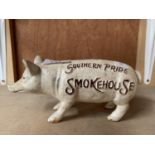 A CAST 'SOUTHERN PRIDE SMOKE HOUSE' PIG MONEY BOX 20CM LONG