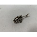 A MINIATURE SILVER FISH PIN CUSHION - STAMPED "STERLING"
