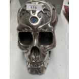 A WHITE METAL DECORATIVE SKULL 23CM LONG