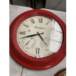 A VERY LARGE RED PLASTIC FRAMED FARRINGTON CLOCK WITH CREAM FACE AND BLACK ROMAN NUMERALS AND