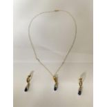 A 9 CARAT GOLD AND BLUE STONE PENDANT AND NECKLACE CHAIN WITH A PAIR OF MATCHING EARRINGS. GROSS
