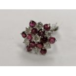 AN 18CT WHITE GOLD DIAMOND AND RUBY CLUSTER RING, TOTAL DIAMOND WEIGHT 1.45 CARATS, WEIGHT 5.6