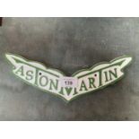 A CAST ASTON MARTIN SIGN 27CM ACROSS