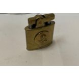 A BRASS PETROL LIGHTER WITH RAF CREST