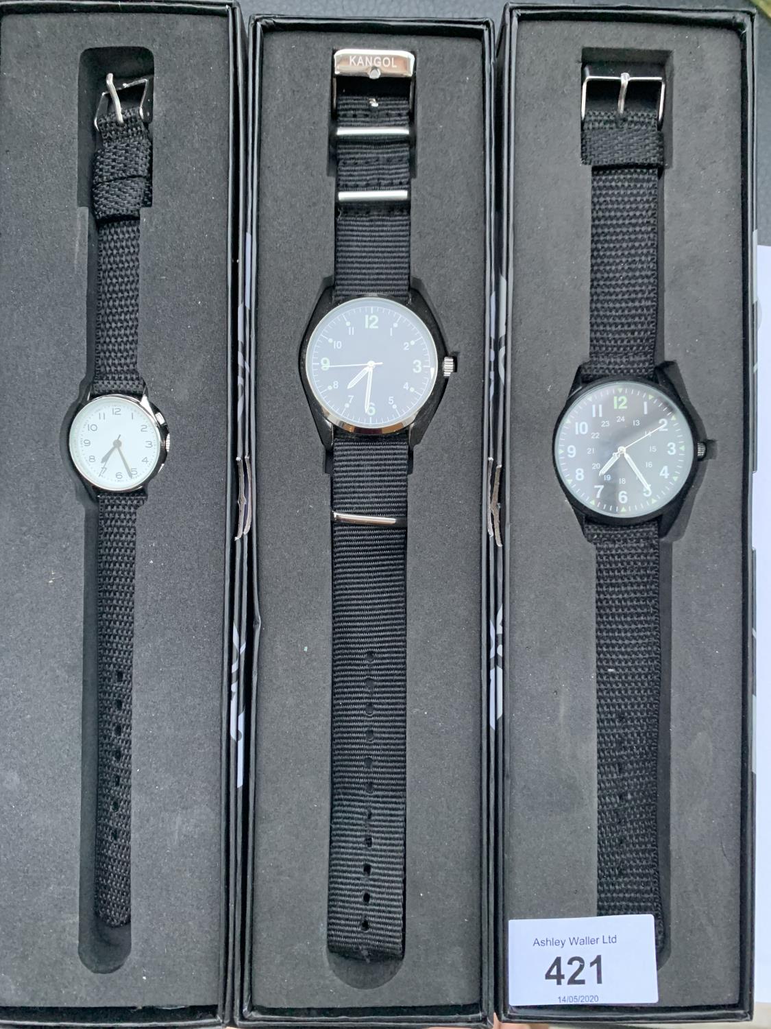 THREE NEW AND BOXED FASHION WATCHES WITH BLACK CANVAS STRAPS - ENGRAVED ON THE BACK - EAGLEMOSS