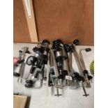 A LARGE QUANTITY OF BAR BOTTLE HOLDERS SOME WITH OPTIC MEASURES