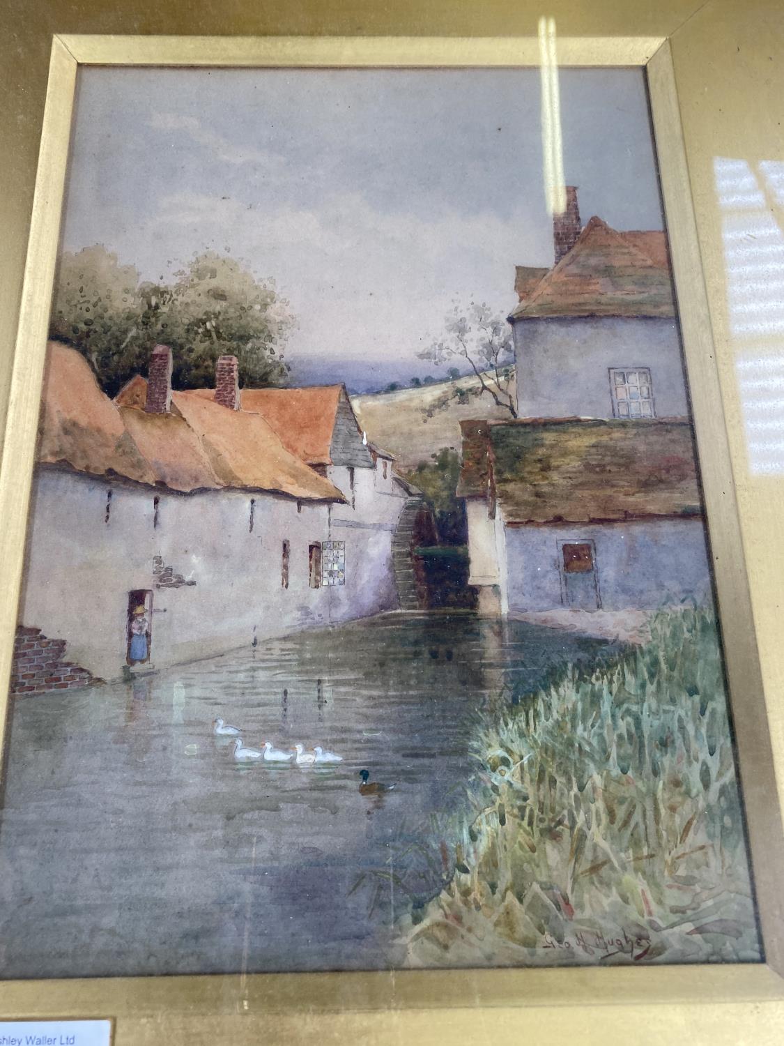 A GILT FRAMED WATERCOLOUR OF HOUSES, SIGNED LOWER RIGHT CORNER GEOFF HUGHES - Image 2 of 2