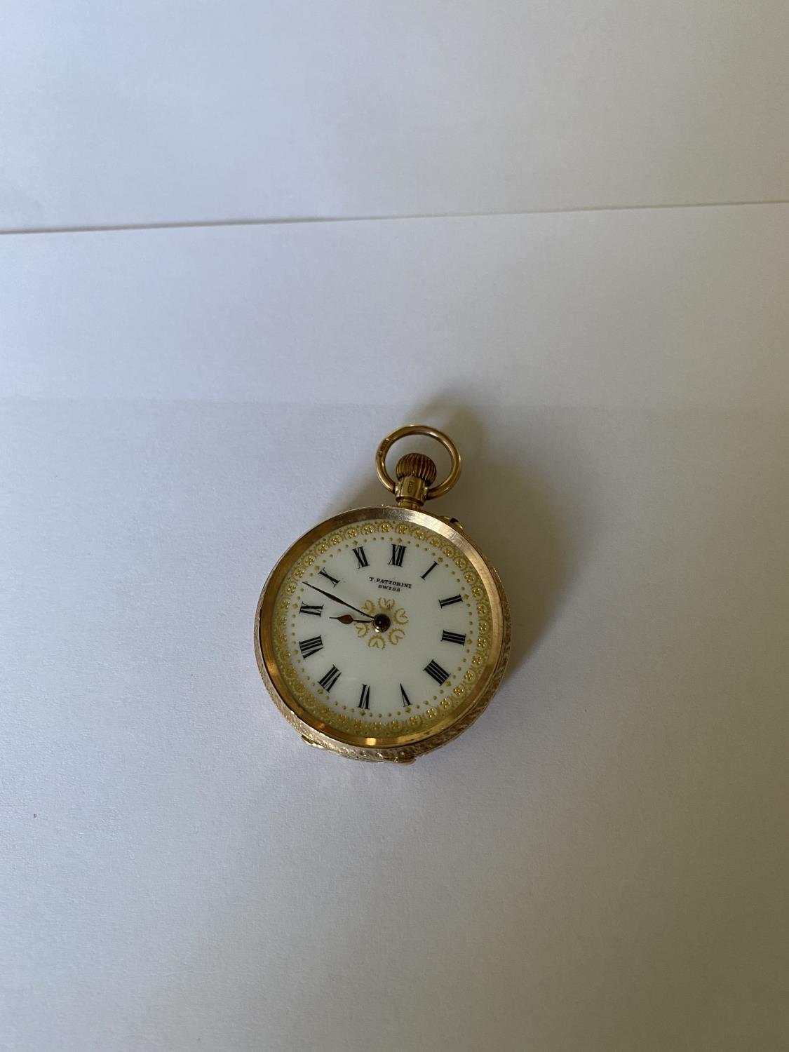 A LADIES T FATTORINI SWISS POCKET WATCH WITH 9 CARAT YELLOW GOLD CASE. WEIGHT 29.7 GRAMS, DIAMETER