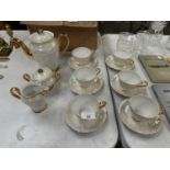 A LUSTRE COFFEE SET COMPRISING OF SIX CUPS AND SAUCERS, A COFFE POT, SUGAR BOWL AND CREAM JUG