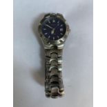 A GENTS FASHION WATCH WITH BLUE FACE AND SILVER METAL STRAP IN WORKING ORDER