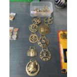 NINE HORSES BRASSES TO INCLUDE A TRIO OF HORSESHOES, SCROOGE, A WINDMILL, ELEPHANT ETC