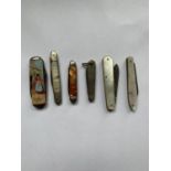 SIX PEN KNIVES ONE DEPICTING A WELSH LADY WITH SPINNING WHEEL