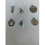 AN ASSORTMENT OF SIX SILVER PENDANTS TO INCLUDE A HEART DISC, WHITE POINSETTA, GREEN STONES ETC