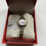 A BOXED LADIES SEKONDA WATCH WITH SQUARE SILVER METAL FRAMED FACE IN WORKING ORDER