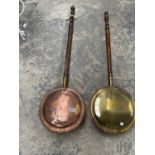 TWO WARMING PANS TO INCLUDE ONE COPPER AND ONE BRASS WITH WOODEN HANDLES