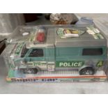 A SUPER CAR FRICTION KING TOY POLICE VAN