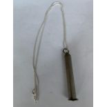 A SILVER NECKLACE WITH A PIPE SMOKERS TOOL TO INCLUDE A TAMPER AND THREE CLEANING TOOLS