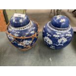 A PAIR OF ORIENTAL BLUE GINGER JARS WITH LIDS (ONE WITH CORK)