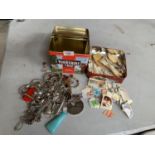 A TIN OF VARIOUS STAMPS AND A FURTHER TIN A WHITE METAL COSTUME JEWELLERY