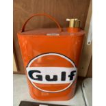 A ORANGE METAL GULF PETROL CAN