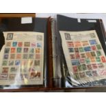 A COLLECTION OF CHINESE STAMPS IN AN ALBUM