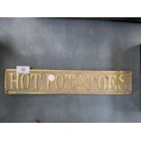 A VINTAGE BRASS 'HOT POTATOES' SIGN