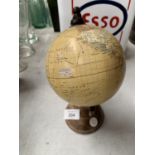 A SMALL DESK GLOBE ON BASE APPROXIMATELY 24CM HIGH