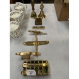 EIGHT ITEMS OF BRASSWARE TO INCLUDE A LONDON BUS, A GRETNA GREEN ANVIL, A PLANE, CLOTHES PEG, BELLS,