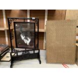A DECORATIVE SCREEN WITH GLASS PANEL CAT DESIGN DEPICTING A BLACK AND WHITE CAT ON ONE SIDE AND A