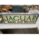 A JAGUAR SALES AND SERVICE ILLUMINATED LIGHT BOX SIGN 91CM X 31CM X 10CM