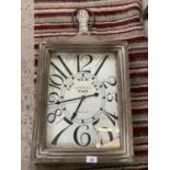 A LARGE RECTANGULAR 'THE NEW ERA PARIS' WALL CLOCK IN THE STYLE OF A POCKET WATCH (WINDER TOP