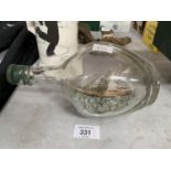 A GALLEON SHIP IN A GLASS BOTTLE APPROXIMATELY 22CM LONG