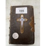 A LEATHER BOUND PRAYER BOOK (CLASP BROKEN) GILT EDGED PAGES SEEN SIGNED INSIDE 1897