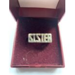 A BOXED SILVER 'SISTER' RING