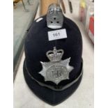 A POLICE HELMET WITH MERSEYSIDE BADGE