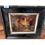 A FRAMED GLASS PICTURE OF A MONK PAINTING A SLEEPING CARDINAL