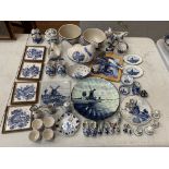 A LARGE COLLECTION OF BLUE AND WHITE DELFT STYLE POTTERY TO INCLUDE PLATES, CLOGS, DISHES, EGG