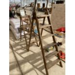 TWO PAIRS OF VINAGE WOODEN STEP LADDERS ONE FOUR RUNG AND ONE SIX RUNG