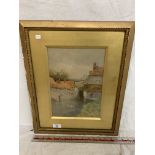 A GILT FRAMED WATERCOLOUR OF HOUSES, SIGNED LOWER RIGHT CORNER GEOFF HUGHES