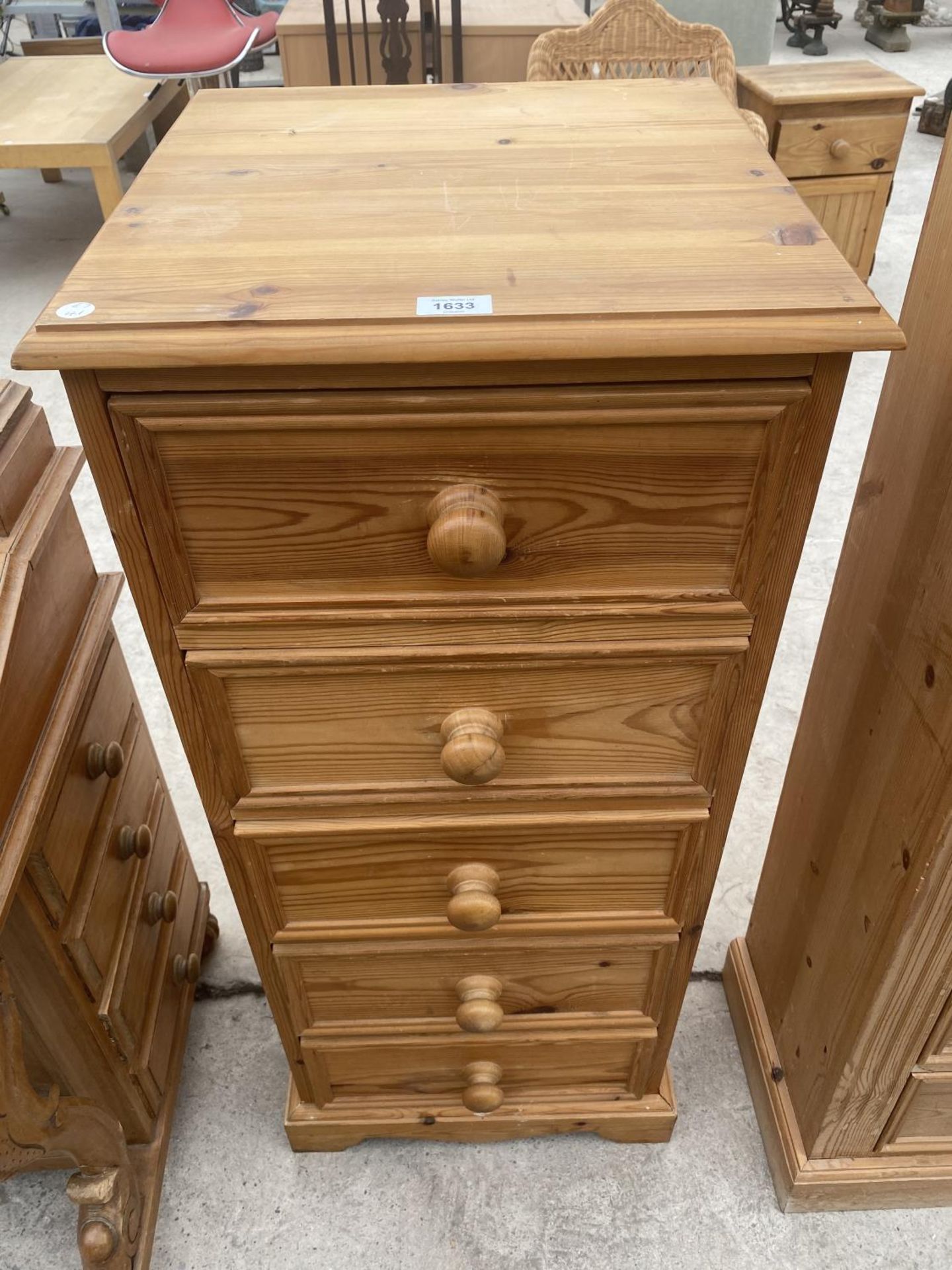 A TALL PINE CHEST OF FIVE DRAWERS