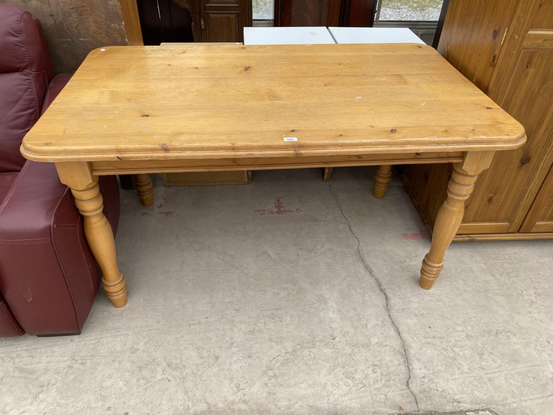 A RECTANGULAR PINE DINING TABLE