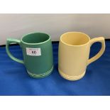 TWO WEDGEWOOD KEITH MURRAY TANKARDS ONE GREEN (A/F) AND ONE YELLOW