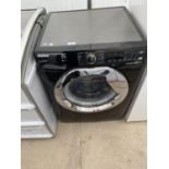 A BLACK HOOVER SILENT INVERTER WASHING MACHINE IN WORKING ORDER