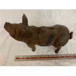 A VINTAGE CAST IRON PIG APPROXIMATELY 14 INCHES LONG